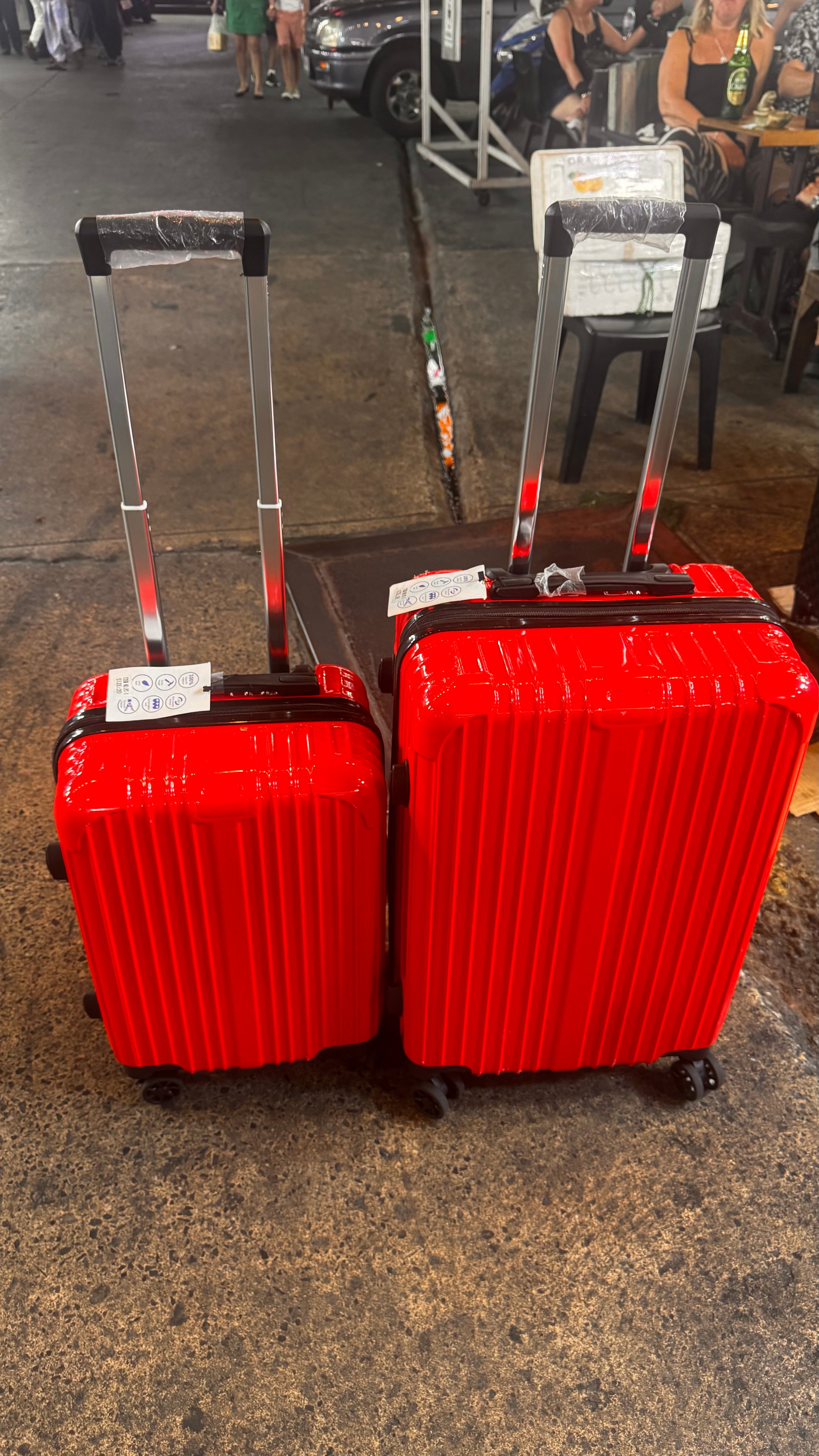 Set of 2 red cabin and mid size suitcase